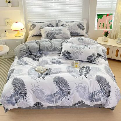 White duvet cover with tropical palm leaf pattern in gray and black featuring matching pillowcases from decorbites cozy cotton bedding set
