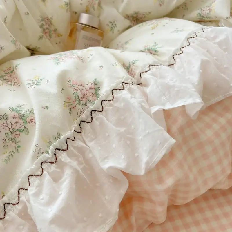 White floral-patterned ruffled pillowcase with delicate embroidered zigzag trim in pastel pink decorbites cotton small florals bedding set