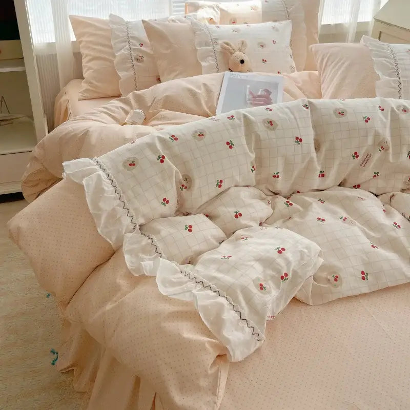 Cream-colored decorbites cotton small florals bedding set with cherry grid pattern, ruffled edges, and subtle stitching details