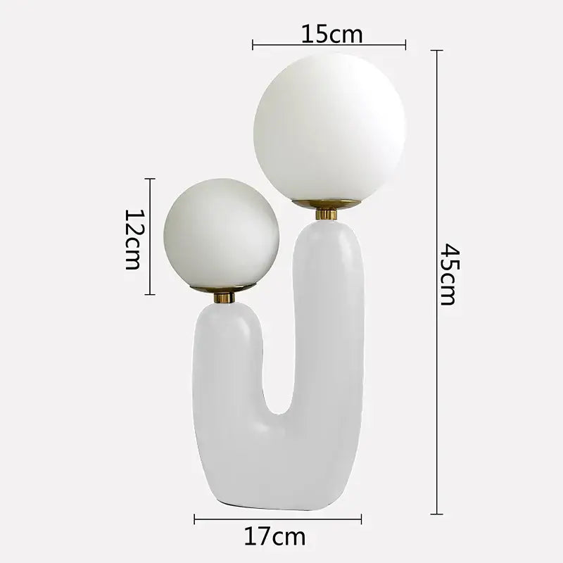 Modern white ceramic ball table lamp with dual spherical glass ball shades and gold-toned accents for bedroom use