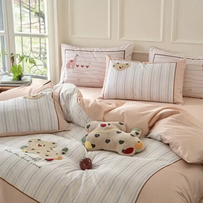 Pastel pink and light blue striped decorbites cotton embroidered bedding set with animal motifs on pillows for bedroom decor