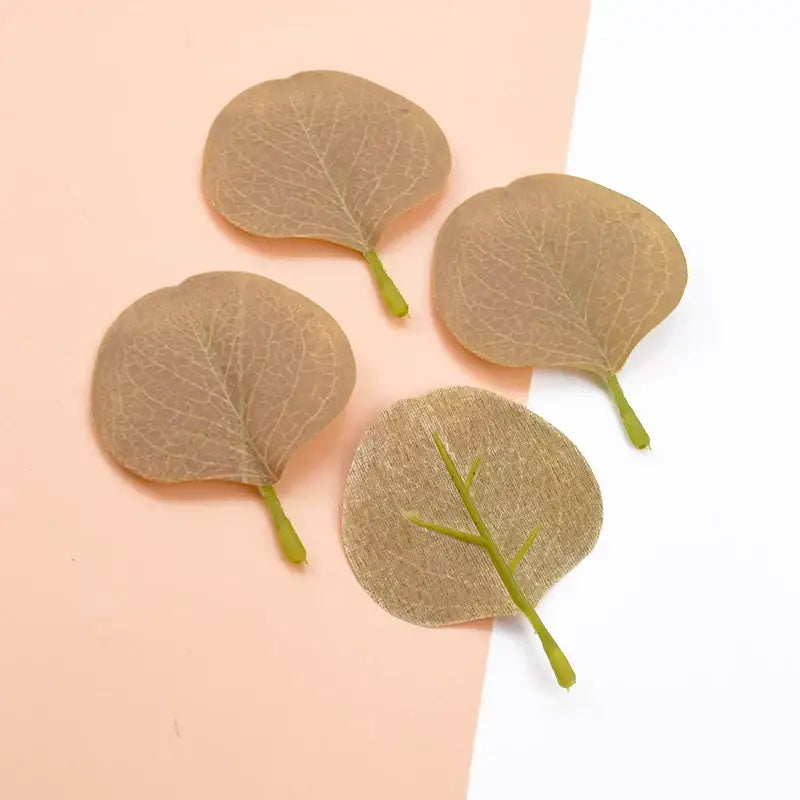 Four translucent beige silk leaf artificial pins with green stems and vein details for pastel pink and green home decor