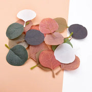 A collection of pastel pink and green silk leaf artificial plants for living room home decor with soft eucalyptus leaves