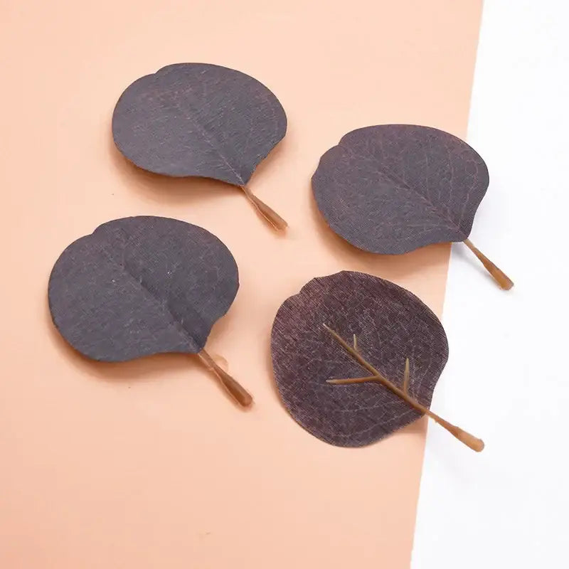 Dark gray silk leaf artificial plants with vein patterns and wooden stems for pastel pink and green home decor