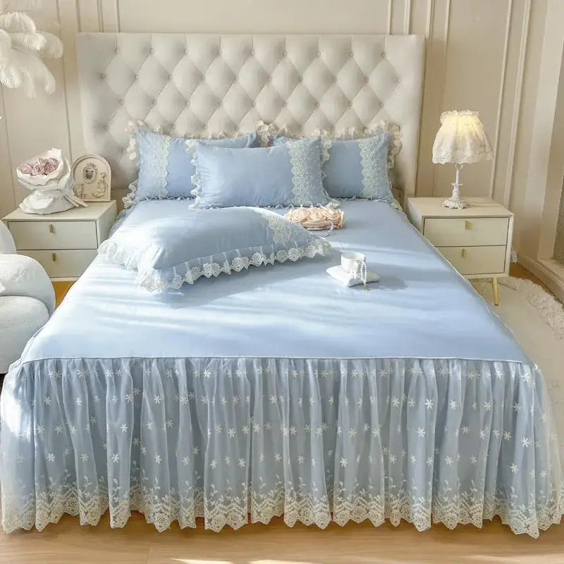 Light blue lace bed sheet skirt with white floral embroidery and scalloped edges in pastel pink lace ruffled sheet set