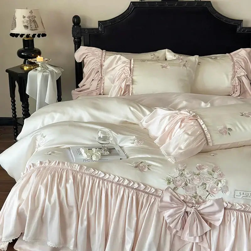 Pastel pink satin bedding set with delicate ruffle flower embroidery and lyocell ruffled trim for luxury bedroom use