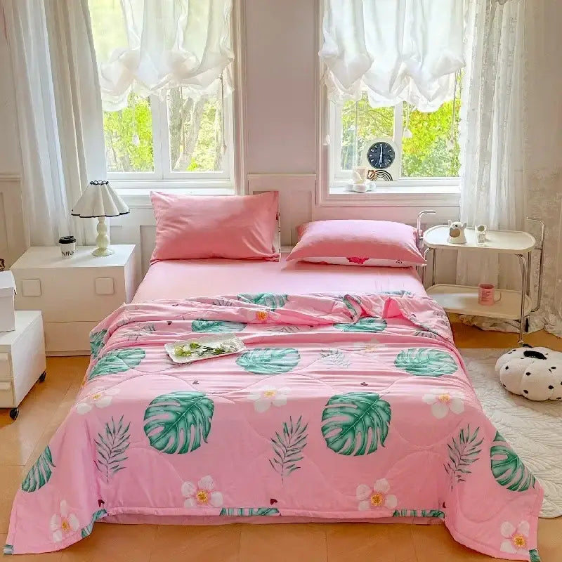 Pastel pink and white cartoon bear printed summer quilt with a pink quilted bedspread featuring tropical leaf decorbites cartoon bear pattern