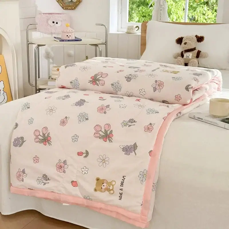 Pastel pink and white cartoon bear printed summer quilt with soft floral pattern and plush peach border by decorbites cartoon bear