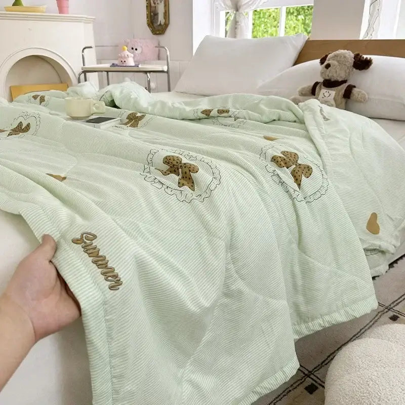Pastel pink and white cartoon bear printed summer quilt with light green corduroy backing embroidered bows decorbites cartoon bear