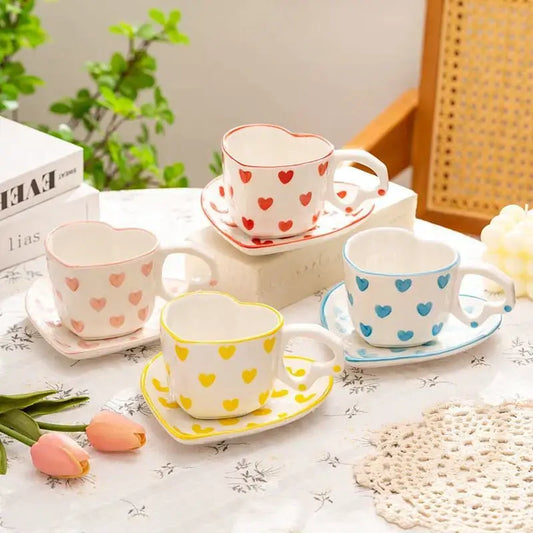 Set of four ceramic 250ml coffee cups with matching saucers featuring pastel polka dot patterns and coordinating rims