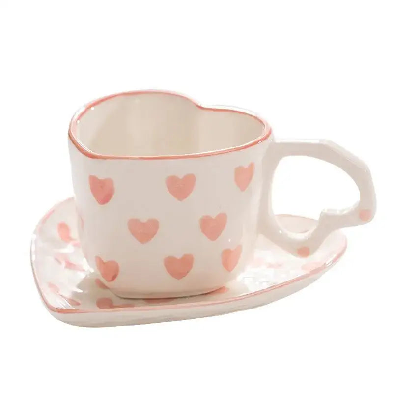 White ceramic heart-shaped 250ml coffee cup with pink hearts and matching saucer in pastel polka dot design