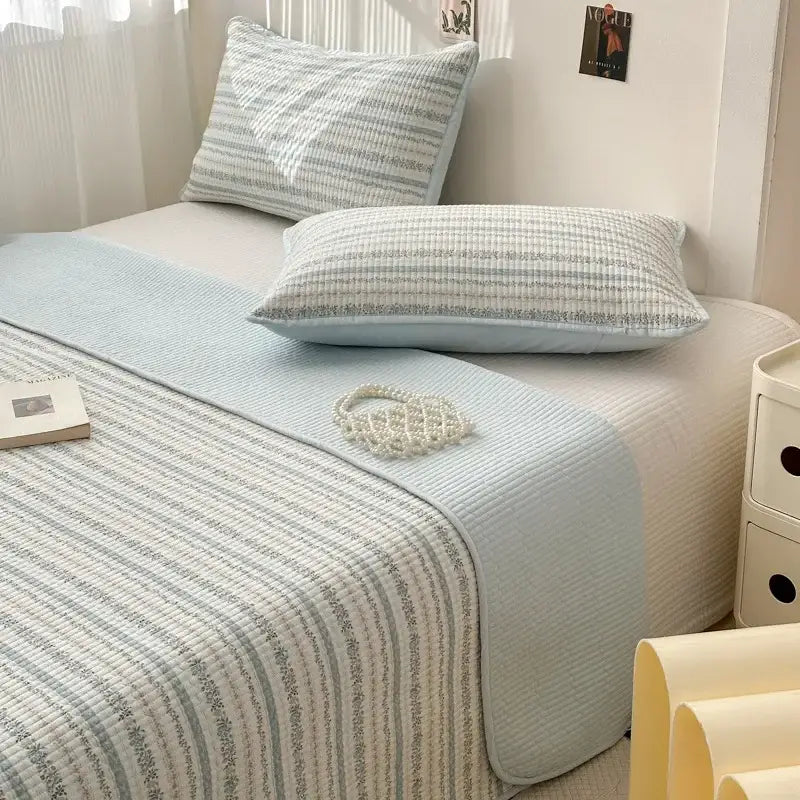 Light blue pastel quilted cotton bed cover with subtle stripes and textured finish for tatami mat bedroom use