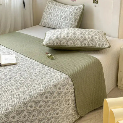 Olive green quilted cotton bed cover with soft plush finish and subtle textured weave for tatami mat use