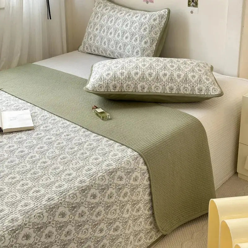 Olive green quilted cotton bed cover with soft plush finish and subtle textured weave for tatami mat use