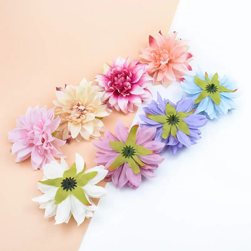 A collection of pastel silk gerbera flowers with layered petals and green centers for wedding and living room decor