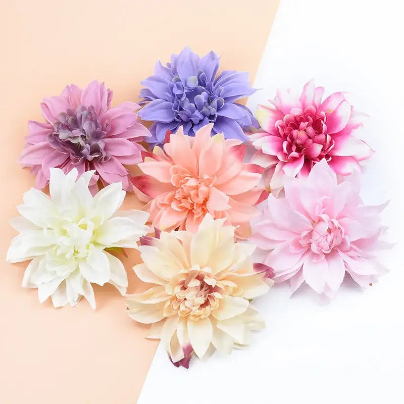A collection of pastel silk gerbera flowers in pink lavender peach and white for wedding and living room decor
