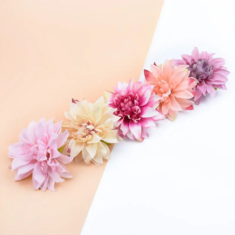 A set of five pastel silk gerbera flowers in pink peach and cream for wedding and living room decor