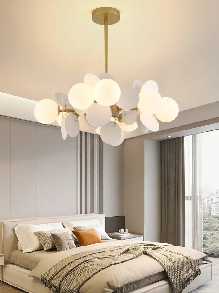 A pastel spherical colorful chandelier pendant lamp with gold rod and frosted glass shades for dining room decorbites decor