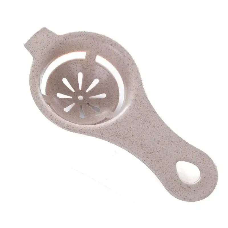 Beige speckled plastic pastel star perforated egg white separator with oval handle for separating egg white efficiently