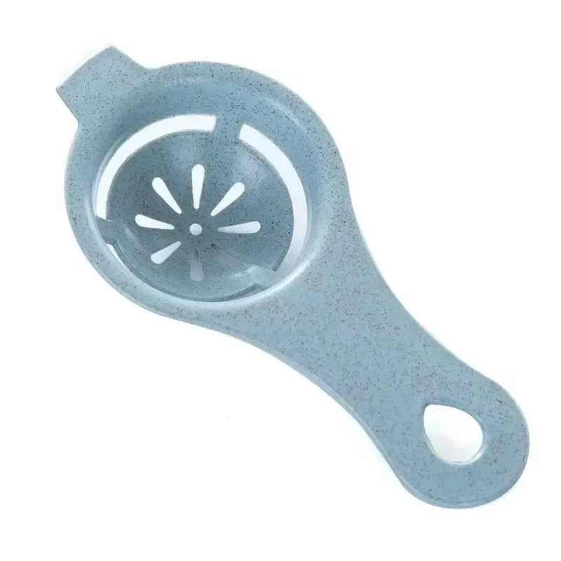 Pastel star light blue speckled plastic egg white separator with circular perforated center and handle for kitchen use