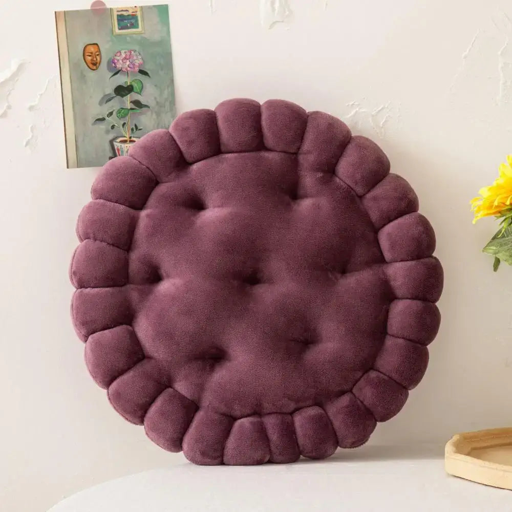 A plush deep purple pastel decorbites cookie biscuit cushion with tufted center and scalloped edge for living room decor