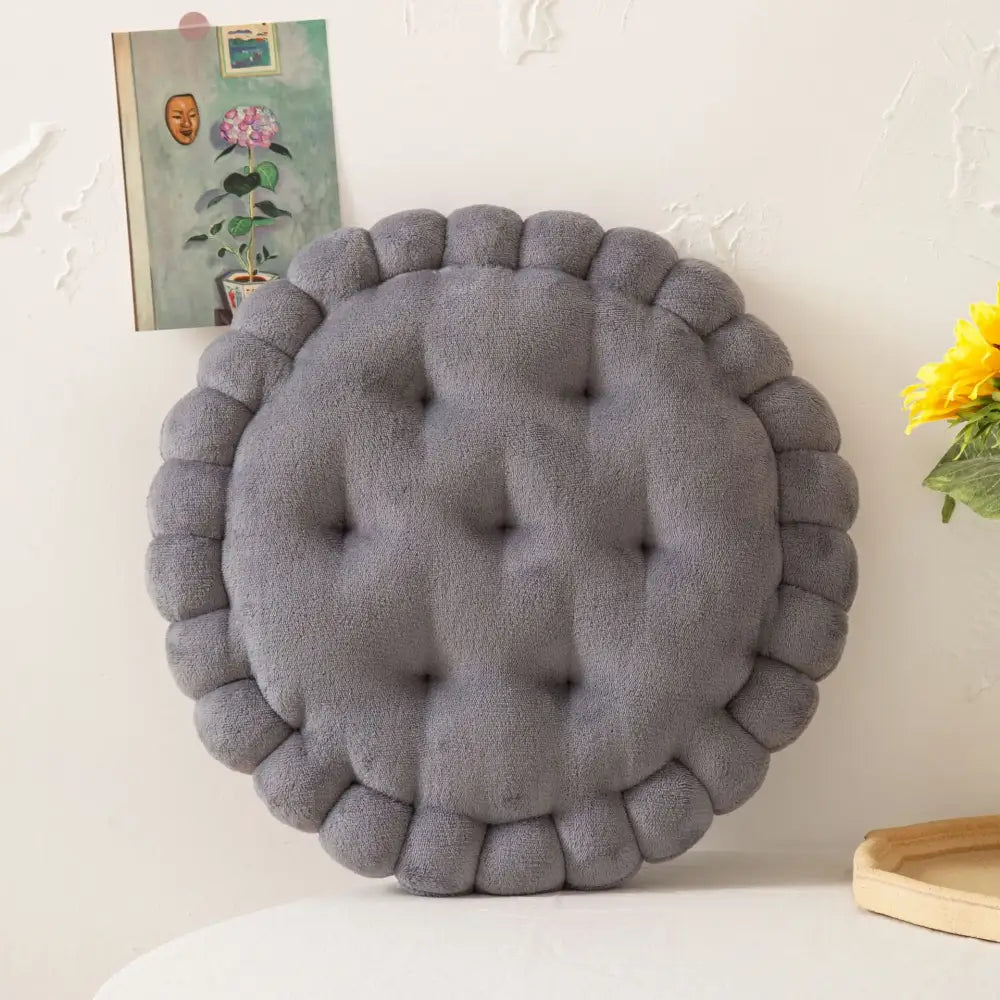Gray tufted cookie biscuit cushion with plush textured surface and scalloped edge for soft living room decorbites throw pillow