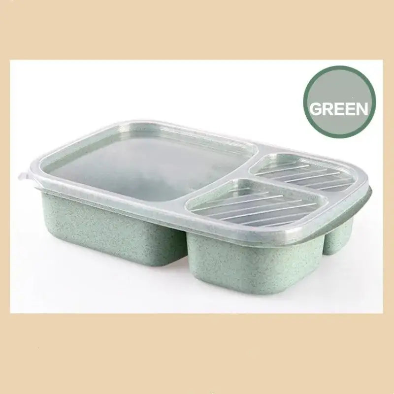 Pastel green speckled wheat straw bento box set with clear lid featuring three compartments and a slotted section