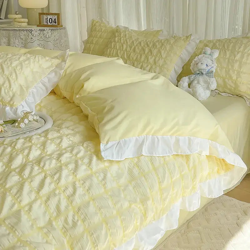 Pastel yellow quilted bedding set with white ruffled trim made of decorbites bubble cotton lace for bedroom decor