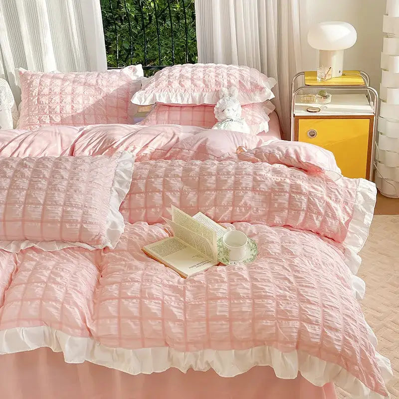 Pink quilted bedding set with white ruffled edges made of decorbites bubble cotton lace fabric for bedroom decor