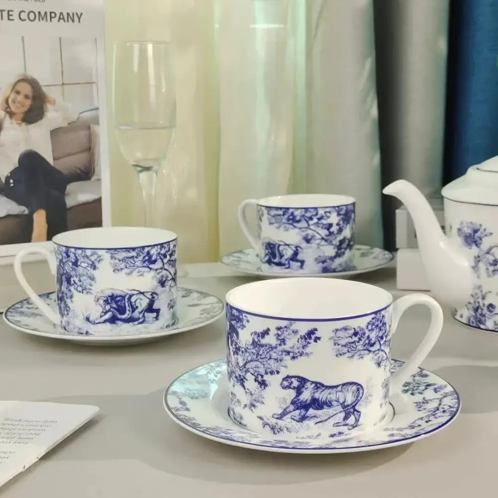 Blue and white porcelain teacup with intricate jungle lion bone designs from decorbites jungle lion tea set collection