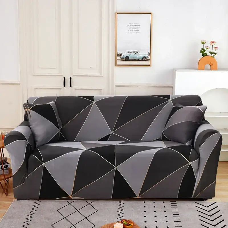 A sleek stretchy sofa cover with modern black and gray geometric pattern and thin white lines for living room use