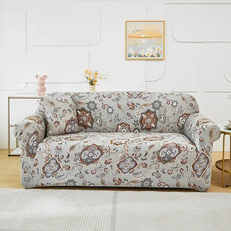 Gray sofa cover with intricate brown blue and white floral and paisley patchwork mandala print for living room use
