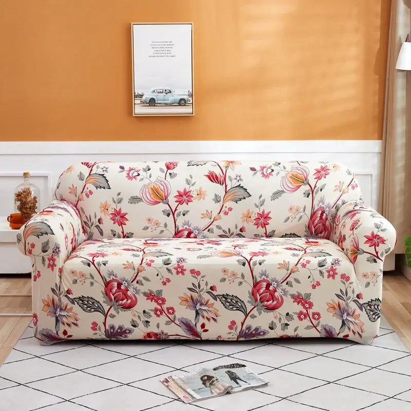 A floral-patterned patchwork mandala printed stretch sofa cover in cream red pink and green for living room use