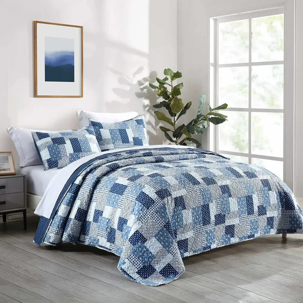 Blue and white patchwork quilt with modern geometric design in rust and cream floral coverlet bedding set for bedroom