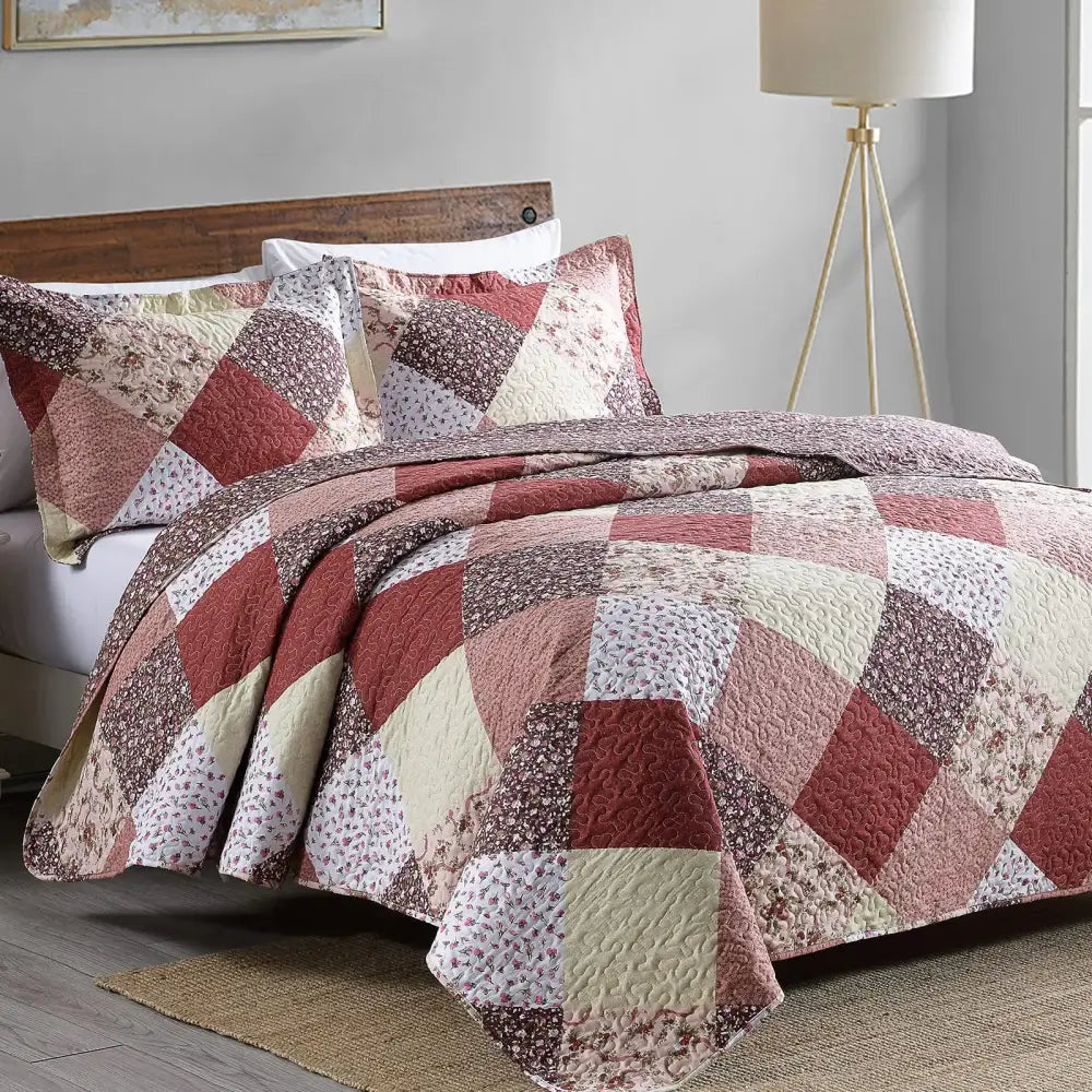 Quilted patchwork coverlet bedding set with rust cream and muted brown floral diamond pattern for bedroom use