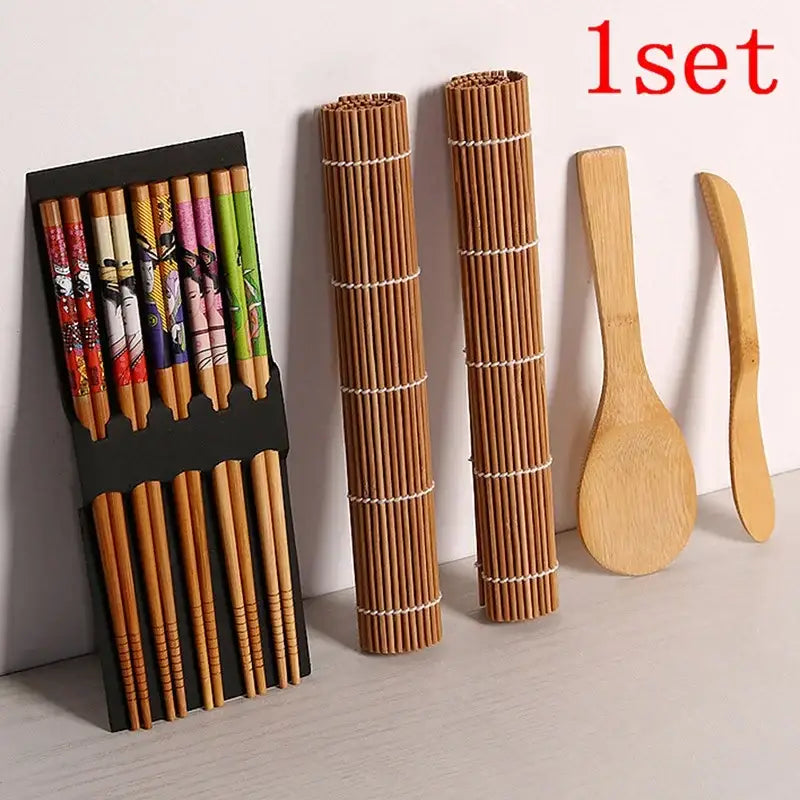 Set of patterned bamboo chopsticks in black holder with sushi mats and wooden utensils in sushi maker set kit