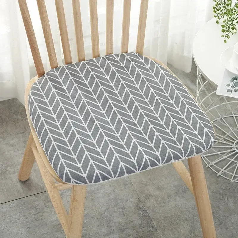 Gray and white geometric-patterned cotton hemp chair cushion for dining chair seating by decorbites