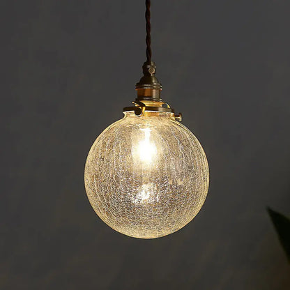 Decorbites pauline modern industrial sphere ceiling light with warm glowing crackled glass and brass hardware for living room
