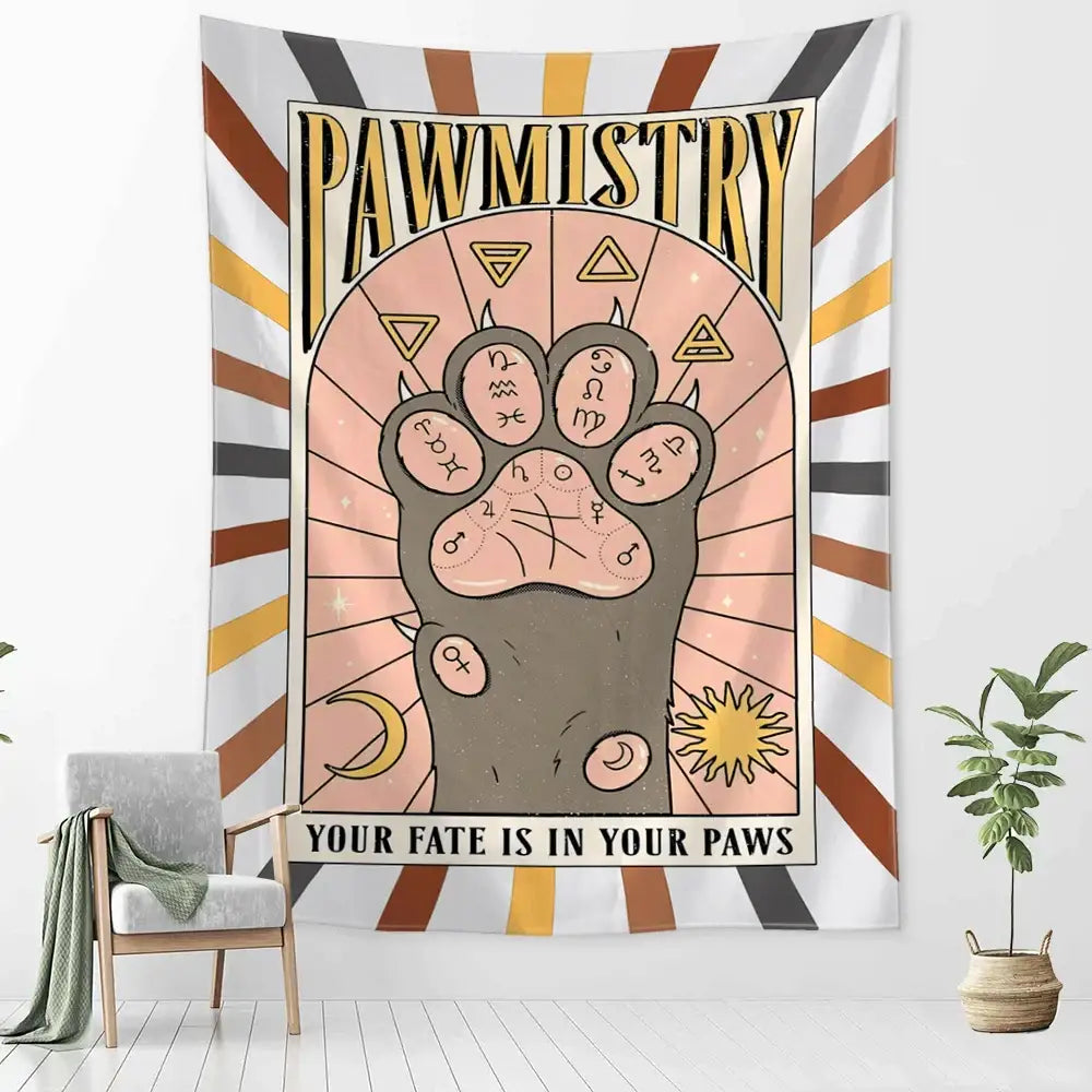 A decorative wall tapestry featuring a stylized cartoon cat claw paw print with astrological symbols and pawmistry text