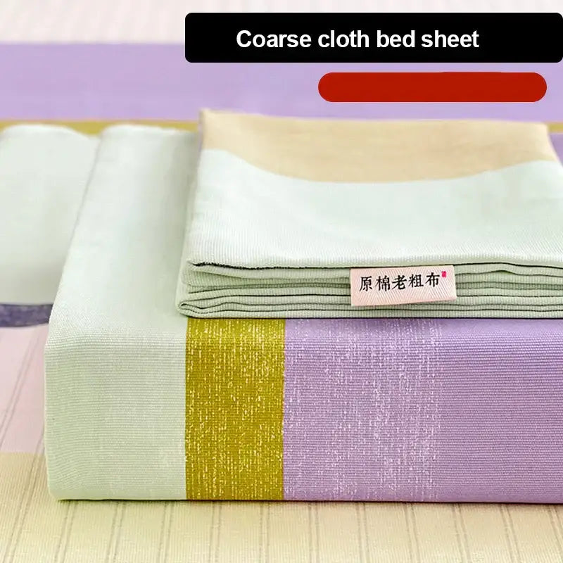 Stacked peach and cream geometric bed sheet set in coarse mint and lavender cotton with gold stripe and original label
