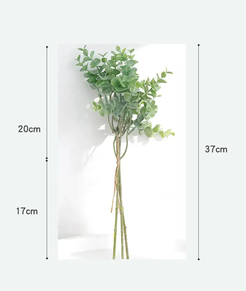 A realistic artificial eucalyptus leaves arrangement with lush green leaves and slender stems in a living room vase