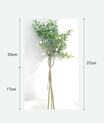 A realistic artificial eucalyptus leaves arrangement with lush green leaves and slender stems in a living room vase