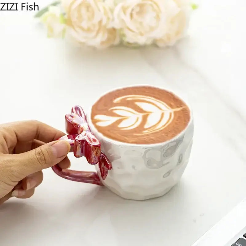 White ceramic bowknot handle porcelain mug with textured surface and vibrant red decorbites bowknot handle