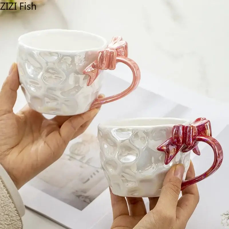 White ceramic bowknot handle porcelain mugs with textured surface and pink decorbites bowknot handles
