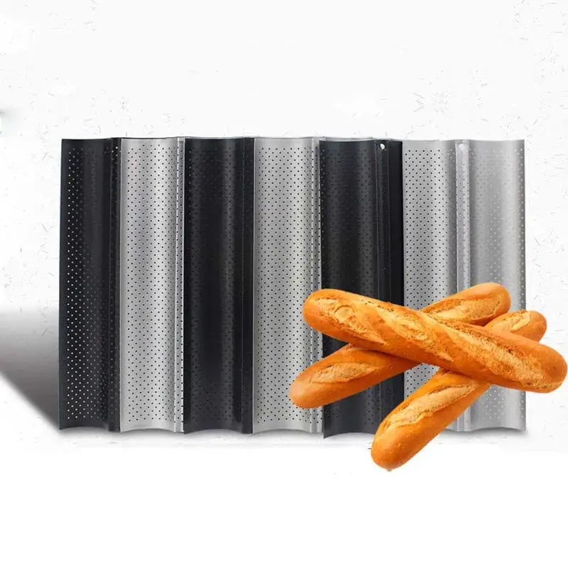 Set of black and silver perforated metal wave bread pans with non-stick surface displayed with golden-brown baguettes