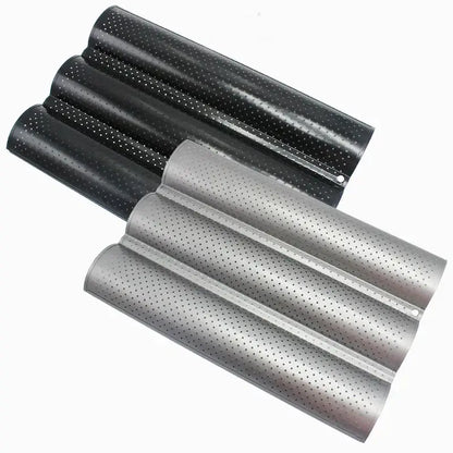 Set of black and silver perforated metal wave bread pans with non-stick coating for baking bread with modern design