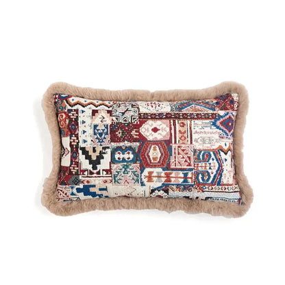 Rectangular decorbites bohemian chenille pillow cover in red and blue with geometric patchwork and tan faux fur border