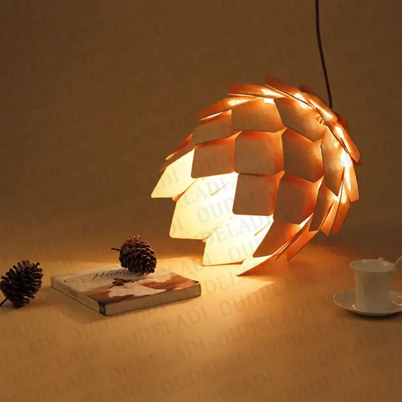 Warm-toned pinecone wooden pendant lights with glowing amber interior for dining room decorbites handmade smart design