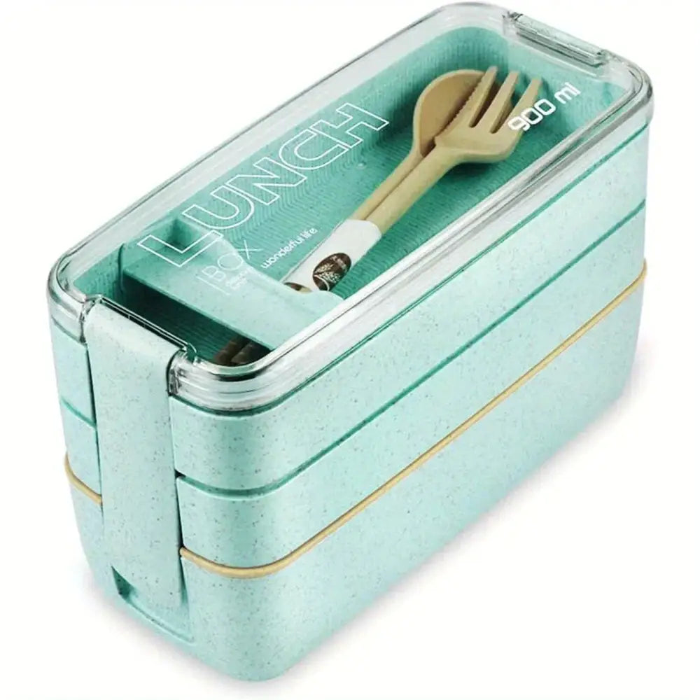 A mint green speckled three tiered kids bento box lunchbox with clear lid and gold trim for kitchen food storage