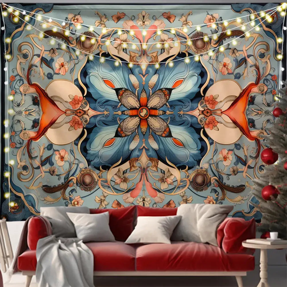 A vibrant blue and orange mandala tapestry from the butterfly series background cloth hangs above a red velvet sofa